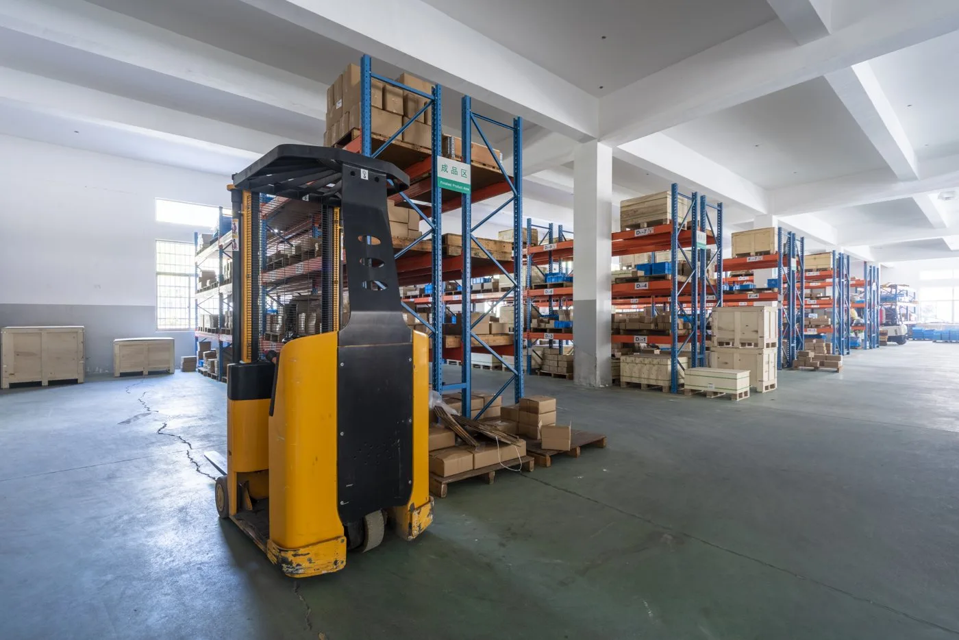 Finished goods warehouse with racking and forklift